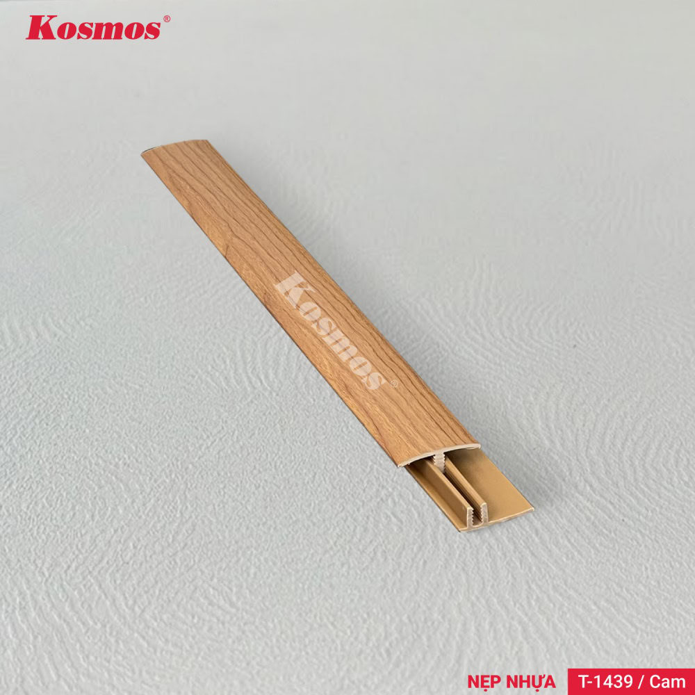 The T-1439 orange plastic T-shaped trim is an accessory for connecting wooden flooring. 