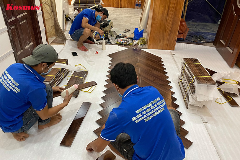 Professional wooden floor installation process by Tony's staff