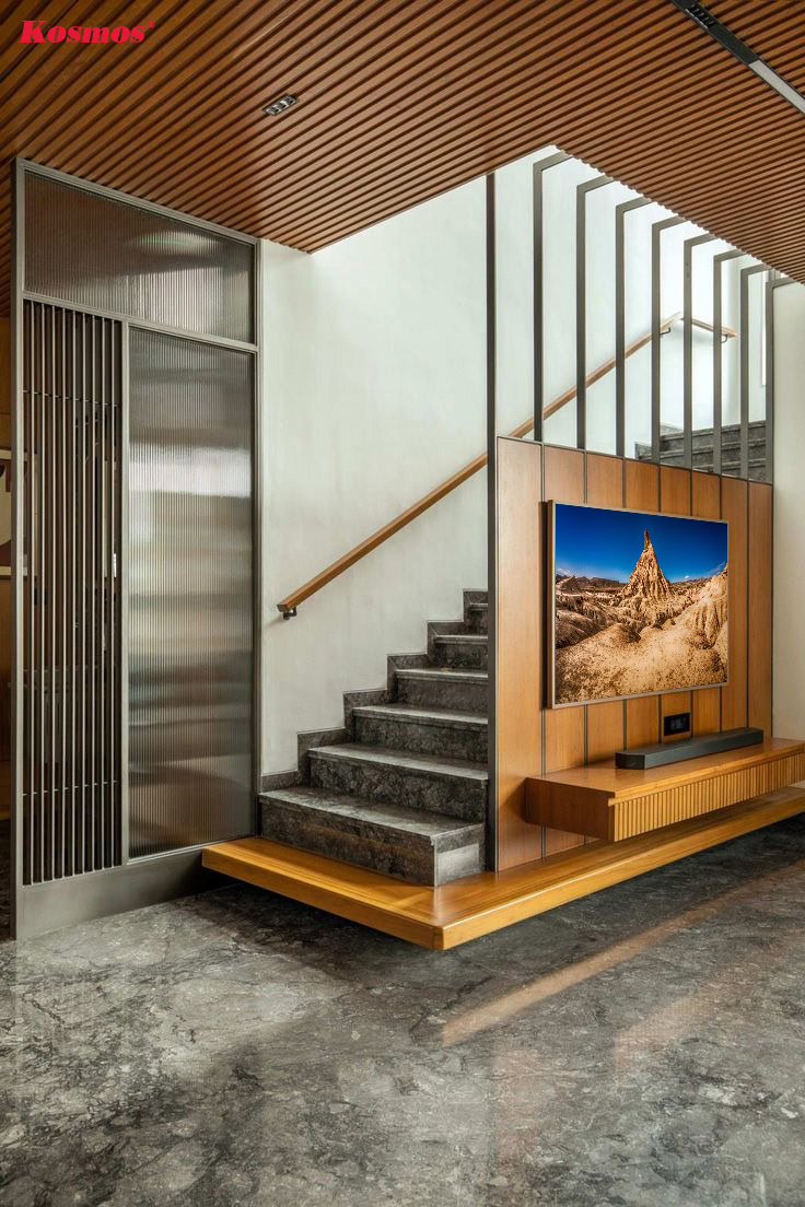 Ứng dụng kệ tivi gỗ làm vách ngăn cầu thang phòng khách