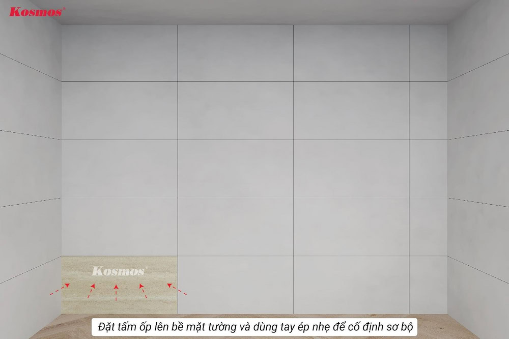 Đặt tấm ốp lên bề mặt tường và dùng tay ép nhẹ để cố định sơ bộ